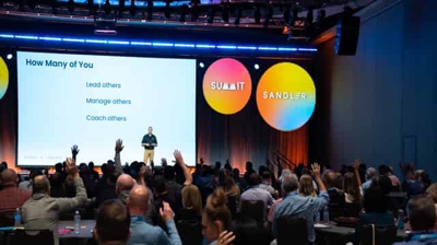 Glenn on stage at Sandler Summit 2025 Photo