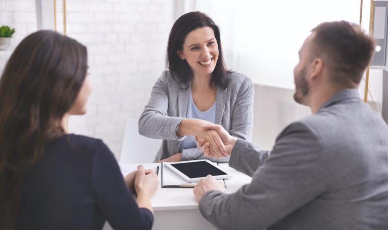 Businesswoman and clients having a discussion about solutions and their needs.